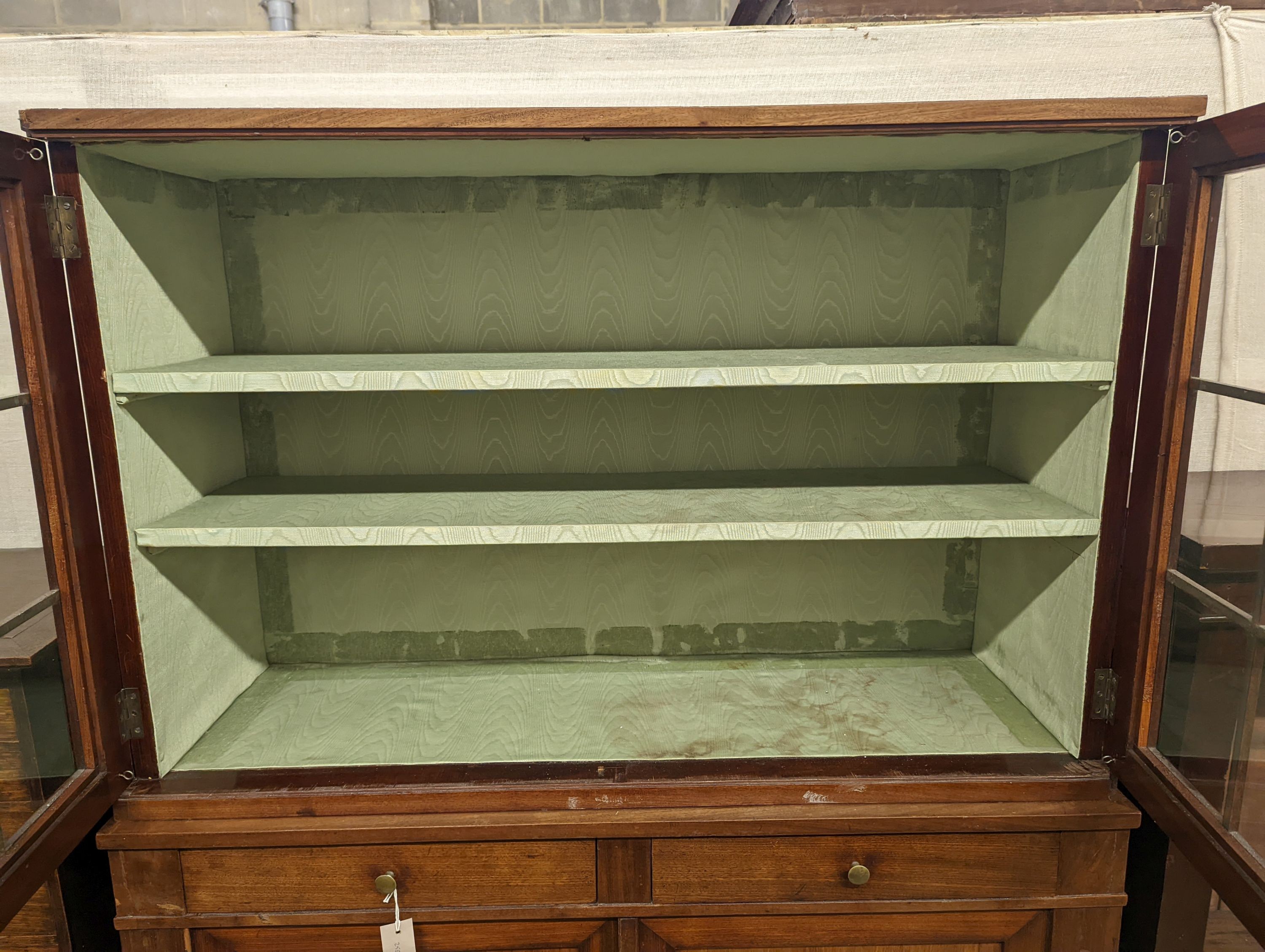 A 19th century Continental mahogany glazed side cabinet, width 116cm, depth 40cm, height 166cm